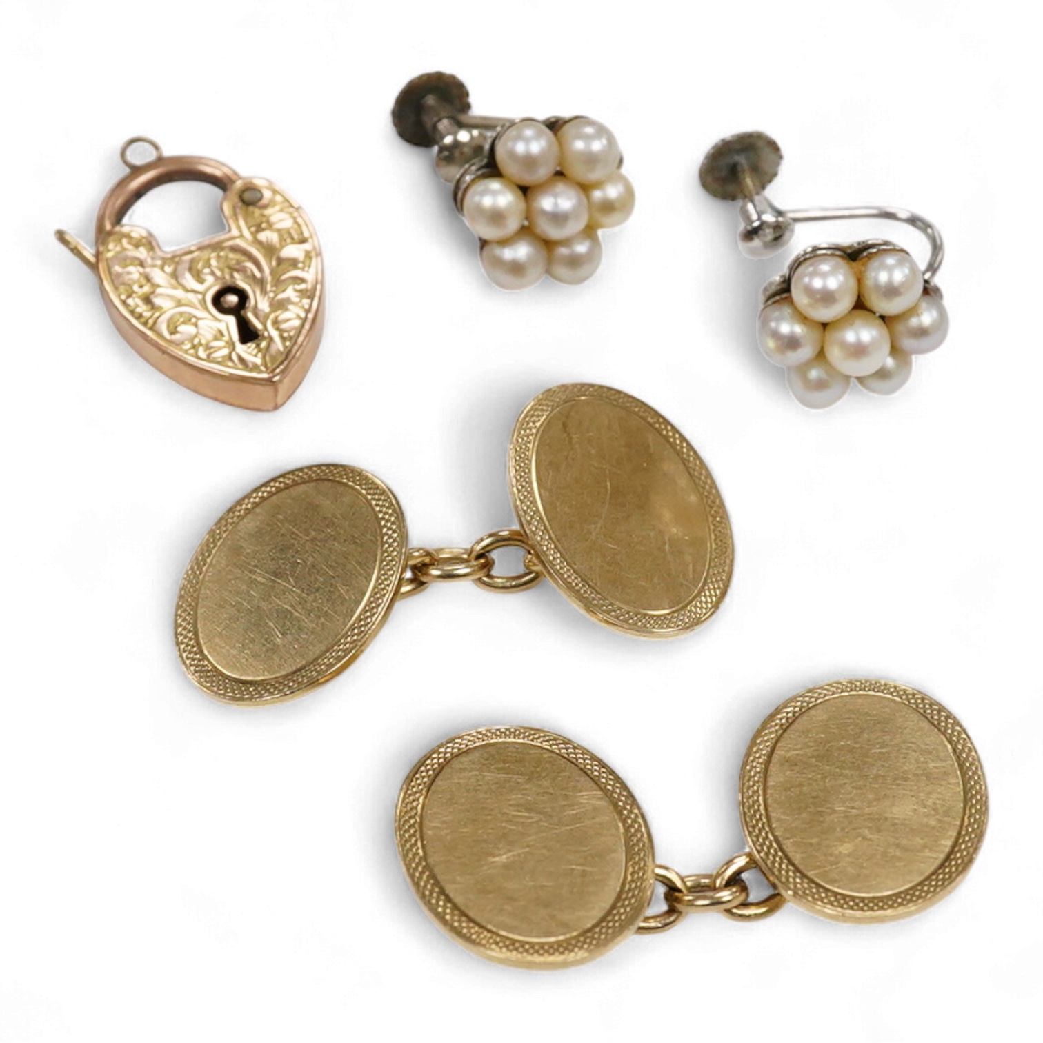 A collection of gold jewels, comprising: a pair of cufflinks by Alabaster & Wilson, mounted in gold, stamped 9ct, combined gross weight approximately 9 grams; together with a Victorian gold heart-shaped padlock clasp wit